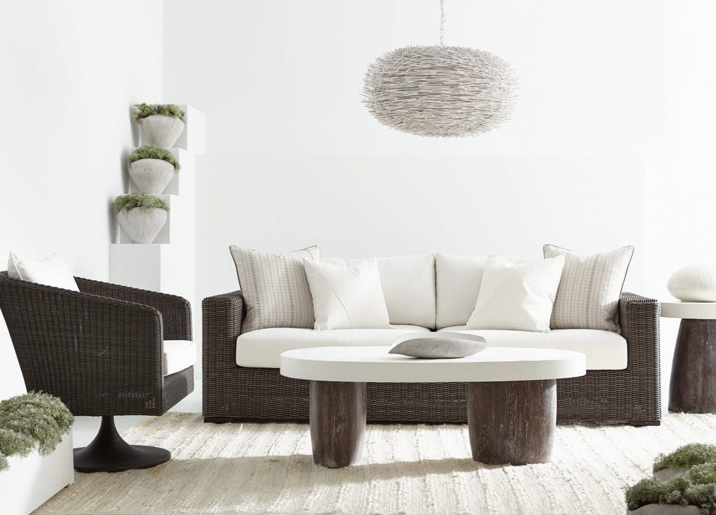 wicker sofa with swivel chair and outdoor furniture with chunky knit rug